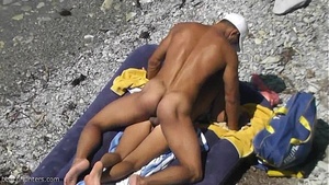 Watch a stranger get naughty at the beach