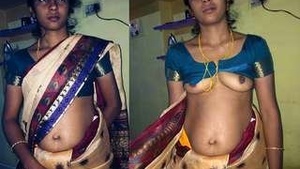 Maya, a Tamil girl, flaunts her breasts in a seductive manner