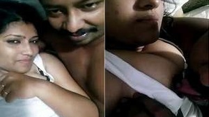 Tamil babe gives a blowjob to her husband's boobs
