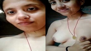 A country girl flaunts her breasts on camera for her partner