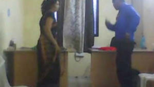 Mature bhabhi gets down and dirty with her younger lover in a steamy office encounter