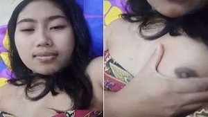 Beautiful girl flaunts her breasts and pussy in a seductive manner