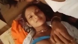 Watch a bhabi's boobs and pussy in action in this village video