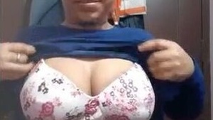 Cute girl flaunts her big boobs and pussy in solo video