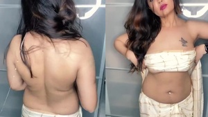 Aabha Paul as Ms. Nair flaunts her hot breasts in blouse strip