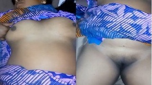 Busty Indian wife grabs her tits and pussy in solo video