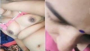 Husband flaunts wife's breasts in public sex show
