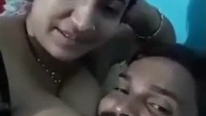 A young couple enjoys intimate moments at home