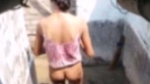 A secret camera captures a country girl's transformation from a bath to a sexy outfit