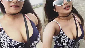 Busty Indian model flaunts her curves on the beach