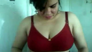 Radha Bhabhi's seductive moves in a red bra and panties