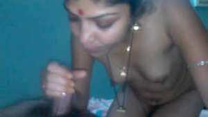 Indian bhabhi gives a blowjob and handjob to her brother-in-law until he cums