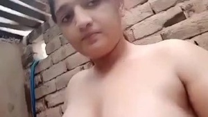 Hot Indian babe flaunts her large breasts in a bathtub
