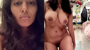 Watch a busty Indian girl flaunt her assets in a sensual show