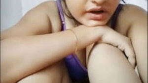 A cute Indian girl shows off her pussy in a steamy video