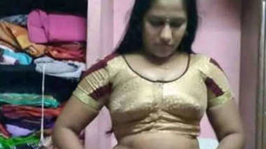 A seductive Indian woman in a black dress gets naughty in the shower