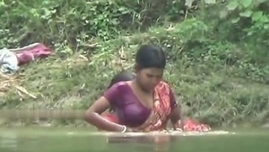 Bhabhi Ganga's shower in the village with her big cleavage